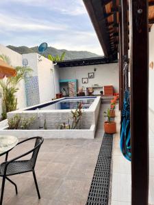 a house with a patio with a swimming pool at Casa Samuel in Honda