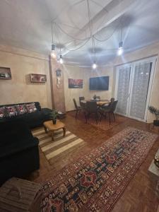 a living room with a couch and a table at Il caminetto in Pradleve