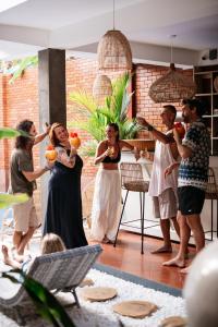 a group of people standing in a kitchen at Roots Retreat in Unawatuna +125 photos
