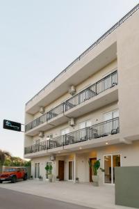 a building with balconies on the side of it at Mulberry Living in Negombo