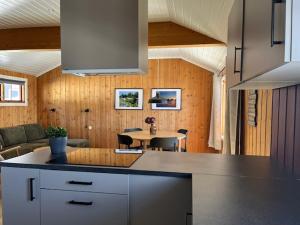 a kitchen with a counter and a table in a room at Nordseter Fjellpark, Hyttegrend in Nordseter