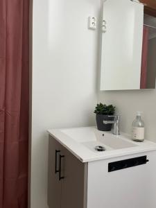 a bathroom with a sink and a mirror at Nordseter Fjellpark, Hyttegrend in Nordseter +35 photos