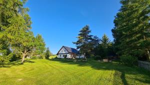 a house in the middle of a grass field at HabaChalupa in Šumperk