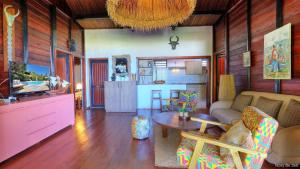 a living room with a couch and a table at Villa Razambe in Mandriankeniheny