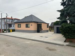 a house with a parking lot in front of it at Fully Equipped Guest House Košice-Barca in Košice