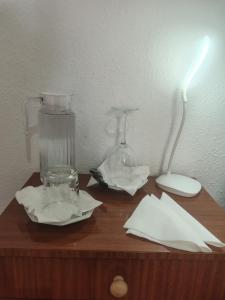 a wooden table with a glass blender and napkins at Hogar, Home, Accueil, Casa, Zuhause in Alicante
