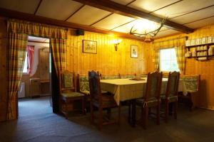 a dining room with a table and chairs at Chalupa Horní Morava in Dolní Morava +17 photos