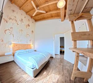 a bedroom with a bunk bed and a ladder at Oasi Da Vinci Apartments Lake Garda View in Tignale