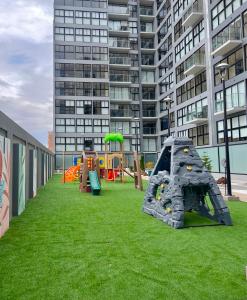 a playground with play equipment on a building at Condo Apartment Suite Misti Volcano View in Arequipa