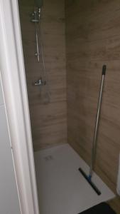 a bathroom with a shower with a pole in it at Chambre privée villa montelimar in Montélimar