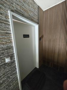 a door in a room with a brick wall at Zimmervermietung-Nbg in Nuremberg