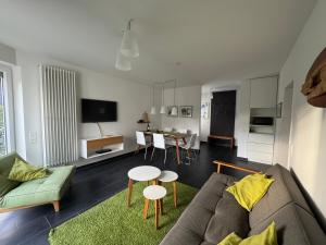 a living room with a couch and a table at Haus Karla in Langeoog