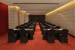 a conference room with black tables and chairs at L'Escape, a Luxury Collection Hotel, Seoul Myeongdong in Seoul