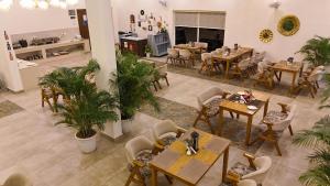 an overhead view of a restaurant with tables and chairs at Corbett The Regnum Resort in Rāmnagar +164 photos