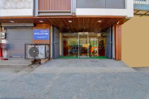 an empty entrance to a building with a garage at Hotel City inn in New Delhi