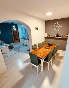 a dining room with a wooden table and chairs at Lola's House in Jajce