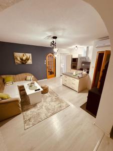 a living room with a couch and a table at Lola's House in Jajce