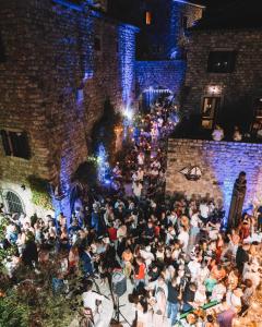 a large crowd of people standing outside of a building at Hotel Palata Venezia in Ulcinj +234 photos