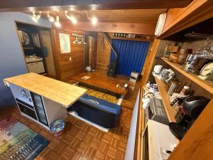 an overhead view of a kitchen with a table in a room at Hakushu hutte in Hokuto