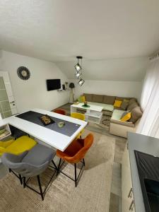 a living room with a table and a couch at Lola's House in Jajce