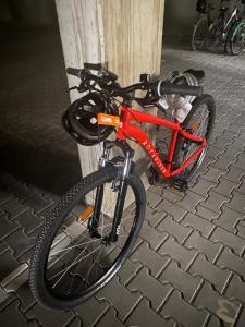 a bike chained to a pole on a street at Apartment Pool Sauna Netflix Bike Parking WIFI YTPremium in Zwiesel