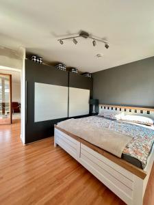 a bedroom with a large bed in a room with avertisement at Molive in Traben-Trarbach +7 photos