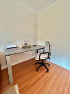 a desk with a chair and a laptop on it at Molive in Traben-Trarbach