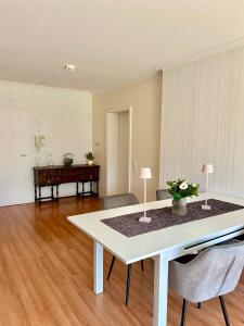 a living room with a white table and chairs at Molive in Traben-Trarbach