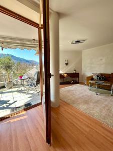 an open living room with a sliding glass door at Molive in Traben-Trarbach
