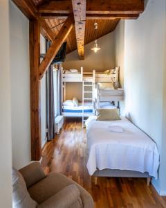 a bedroom with two bunk beds and a couch at Norrqvarn Hotel & Resort by Vänerport in Lyrestad +134 photos