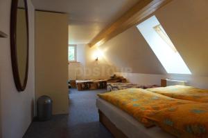 a bedroom with a bed and a large window at Chalupa Horní Morava in Dolní Morava