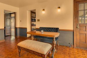 a living room with a table and a couch at The John Collins House in Canfield
