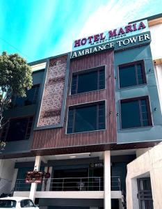 a building with a sign that reads hotel manila insurance tower at Hotel Maria in Dera Bassi