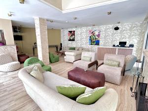 a living room with couches and chairs at Bab louka in Aït Bou Zguia