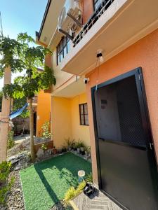 a view from outside of a house with a large screen tv at Amalia Homes Staycation in Palo