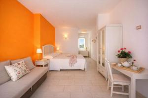 a small room with a bed and a table at Isola Charm B&B - Pool & Nature Stay in Syracuse