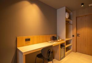 a office with a desk and a chair and a door at The Alma Suite in Alora