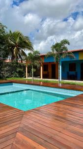 a swimming pool in the middle of a wooden deck at The Jungle, Guriú, CE in Guriú