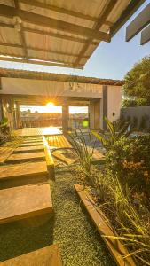 a building with a patio with a bunch of plants at Hotel Pousada DV 360 in Dois Vizinhos