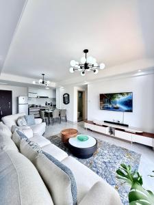 a living room with a couch and a table at Araka Homes-Westlands in Nairobi