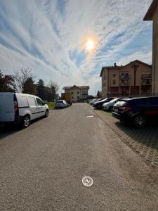 a parking lot with a lot of cars parked at AlbaChiara Apartment in Gallarate