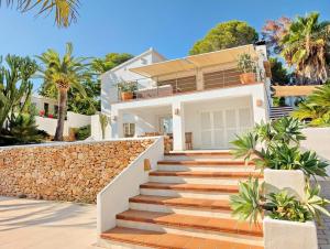 a house with stairs in front of it at Villa Erika by Solidays in Moraira