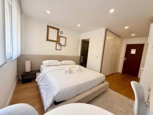 a bedroom with a bed with two towels on it at B044 Studio moderne Croisette 100m in Cannes