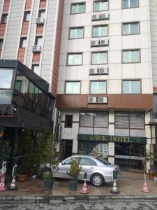 a car parked in front of a hotel at Larok Hotel in Akcaabat