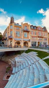 a stone walkway in front of a building at Апартаменти Стефани in Plovdiv