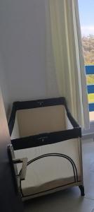 a bed sitting in a room with a window at Panoramic View, Cozy apartment M'diq in M'diq +14 photos