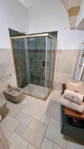 a bathroom with a shower and a toilet and a sink at Maredì Brindisi vacation home in Brindisi +27 photos