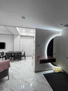 a living room with a dining room with a table at Alvina Private Yard Apartment in Tsaghkadzor