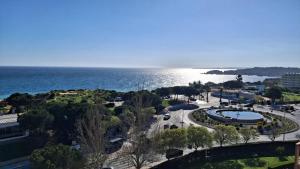 an aerial view of a city and the ocean at Da Rocha Beach 50M, AMAZING Sunset SEA VIEW in Portimão