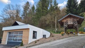 a house in the middle of a road at Ta World apartments in Spodnji Log